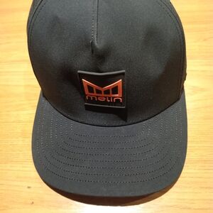 NEW NWOT Melin Odyssey Stacked HYDRO Black Cap w/ Orange Logo Tennis/Golf Cap